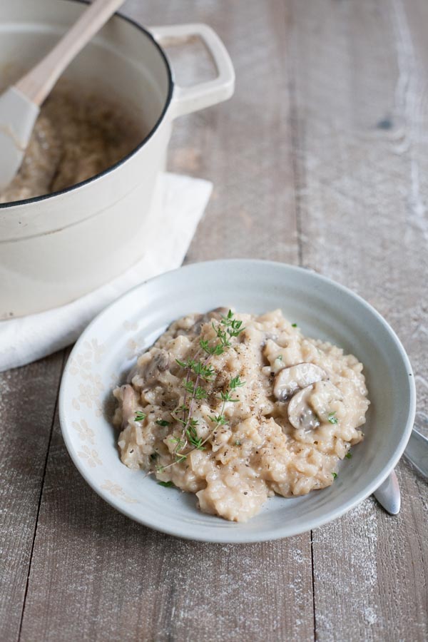 Easy Oven Risotto with Mushrooms | BourbonandHoney.com -- Creamy, cheesy and oh-so comforting, this Easy Oven Risotto with mushrooms is so quick to make that you can even serve it during the week!