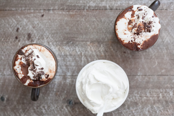 Bourbon Nutella Hot Chocolate with Bourbon and Honey Whipped Cream | BourbonandHoney.com -- Rich, chocolatey, spiked and delicious this Bourbon Nutella Hot Chocolate is topped with a Bourbon and Honey Whipped Cream and perfect for a cold night!