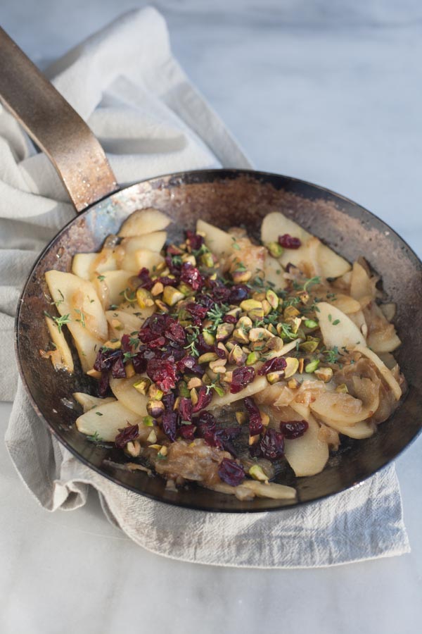 Caramelized Onion Apple Tarts with Blue Cheese and Cranberries | BourbonandHoney.com -- These super flavorful Caramelized Onion and Apple Tarts with Blue Cheese and Cranberries are the perfect bite sized appetizer!