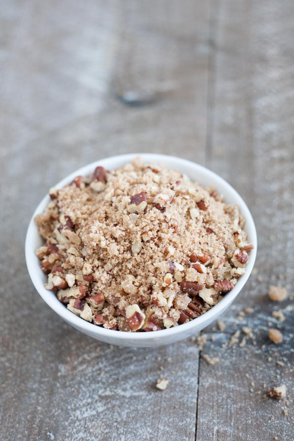 Gingerbread Muffins with Ginger Pecan Crumble | BourbonandHoney.com -- These melt-in-your-mouth Gingerbread Muffins with Ginger Pecan Crumble are seriously flavorful and perfect for breakfast, brunch or a sweet snack!