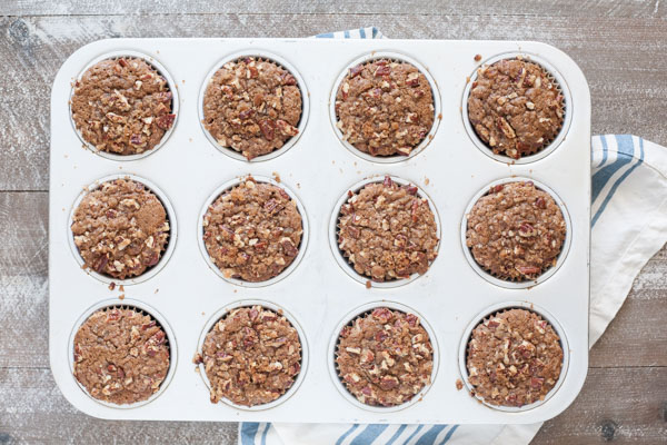 Gingerbread Muffins with Ginger Pecan Crumble | BourbonandHoney.com -- These melt-in-your-mouth Gingerbread Muffins with Ginger Pecan Crumble are seriously flavorful and perfect for breakfast, brunch or a sweet snack!