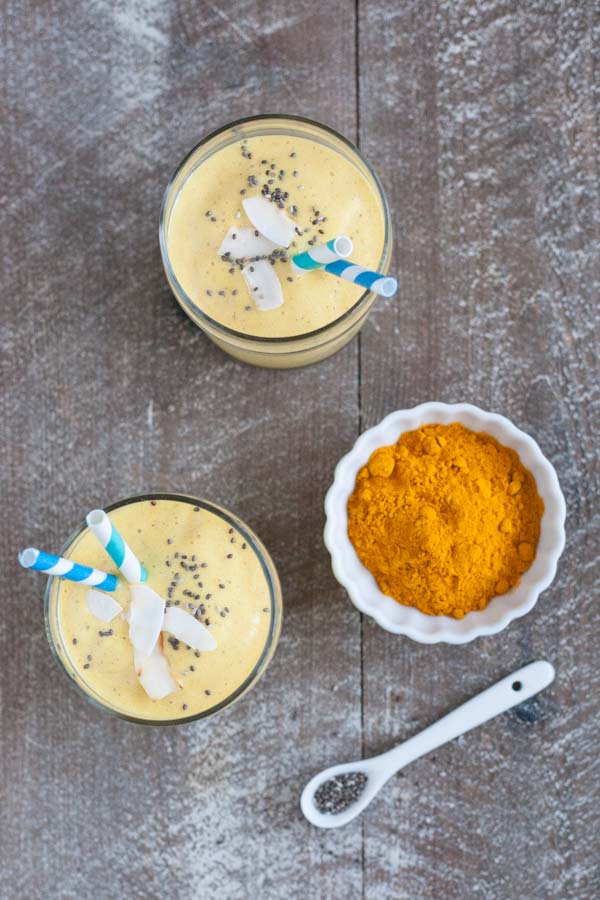 Coconut Mango Turmeric Smoothie | BourbonandHoney.com -- This Coconut Mango Turmeric Smoothie is packed with coconut, mango, banana and turmeric for a fruity snack or super healthy start to your day!