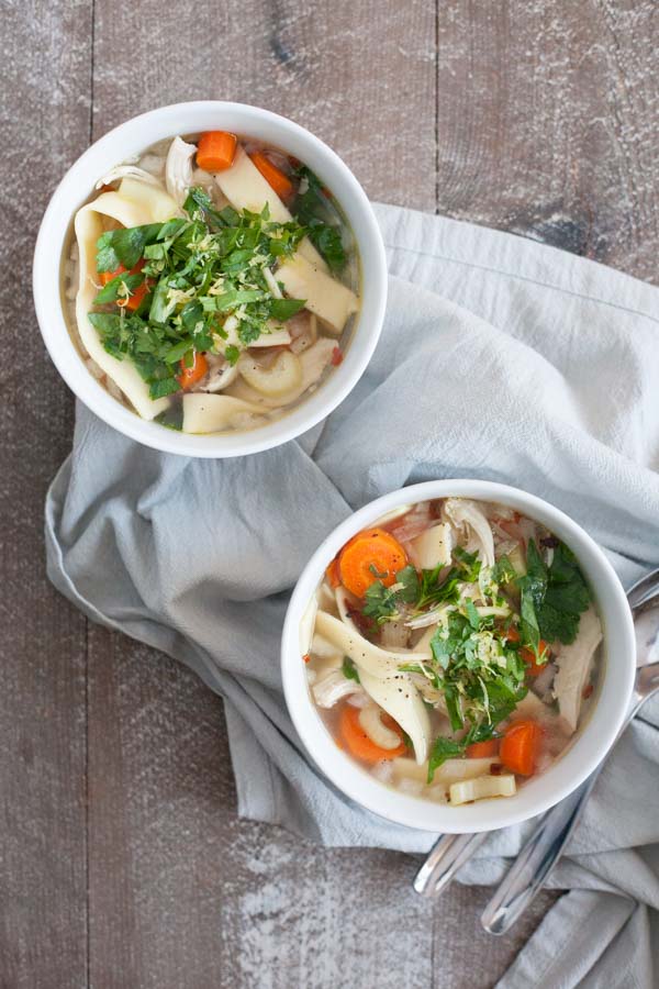 Hearty Slow Cooker Chicken Noodle Soup | BourbonandHoney.com -- Comforting, easy and hearty this Slow Cooker Chicken Noodle Soup is just the thing for when you're feeling crummy or needing to keep warm on a chilly winter day.