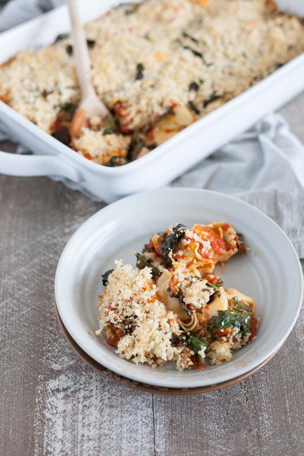 Baked Tortellini from One Pan & Done by Molly Gilbert | BourbonandHoney.com -- Cheesy pasta, kale, tomatoey beans and a crunchy panko topping make this Baked Tortellini a hearty and comforting weeknight dinner that's ready for the oven in just 15 minutes! 