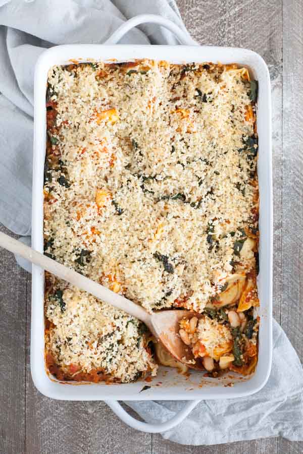 Baked Tortellini from One Pan & Done by Molly Gilbert | BourbonandHoney.com -- Cheesy pasta, kale, tomatoey beans and a crunchy panko topping make this Baked Tortellini a hearty and comforting weeknight dinner that's ready for the oven in just 15 minutes! 
