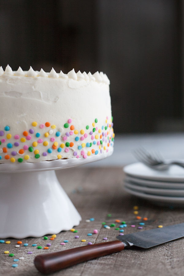 Champagne Cake with Buttercream Frosting | BourbonandHoney.com -- This Champagne Cake with Buttercream Frosting is the perfect cake recipe to celebrate with! It's light, tender, sweet and spiked with champagne!