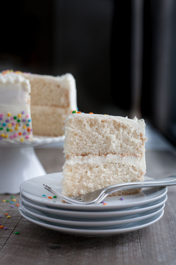 Champagne Cake with Buttercream Frosting | BourbonandHoney.com -- This Champagne Cake with Buttercream Frosting is the perfect cake recipe to celebrate with! It's light, tender, sweet and spiked with champagne!