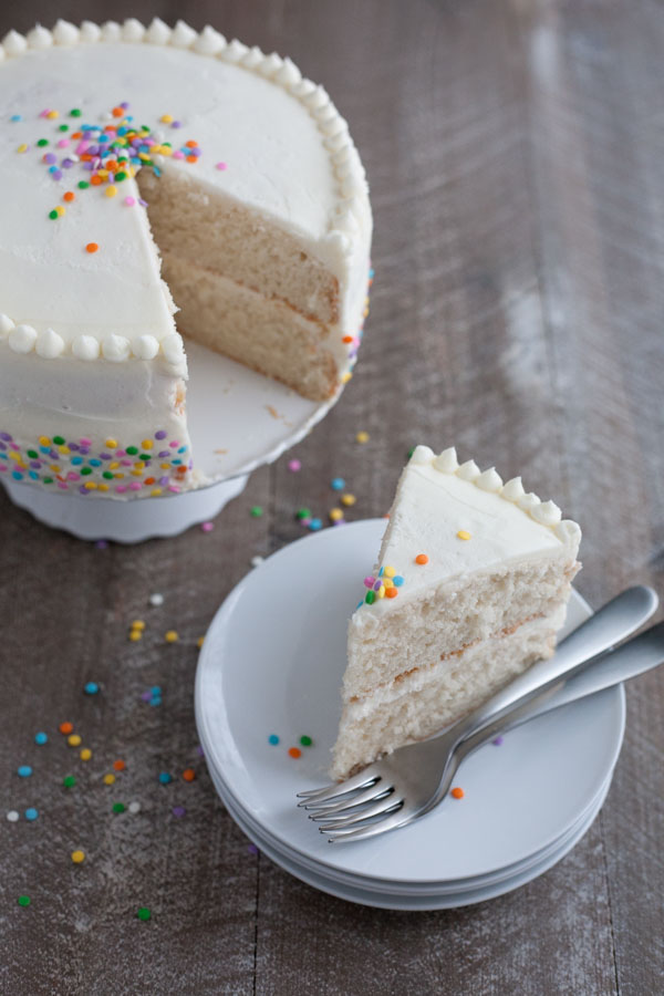 Champagne Cake with Buttercream Frosting | BourbonandHoney.com -- This Champagne Cake with Buttercream Frosting is the perfect cake recipe to celebrate with! It's light, tender, sweet and spiked with champagne!