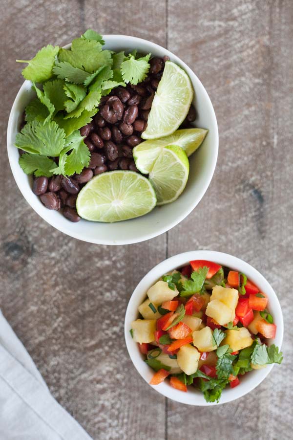 Slow Cooker Jamaican Jerk Chicken Tacos | BourbonandHoney.com -- Spicy, sweet and super flavorful, these Slow Cooker Jamaican Jerk Chicken Tacos are an easy make ahead dinner that can serve a crowd!