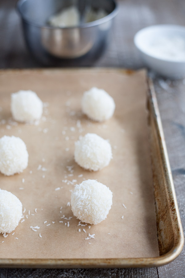 Easy Chocolate Dipped Coconut Macaroons | BourbonandHoney.com -- With double the coconut, these dark chocolate dipped coconut macaroons have a deliciously chewy inside and crispy outside for the perfect sweet treat!