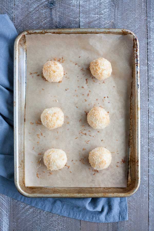 Easy Chocolate Dipped Coconut Macaroons | BourbonandHoney.com -- With double the coconut, these dark chocolate dipped coconut macaroons have a deliciously chewy inside and crispy outside for the perfect sweet treat!