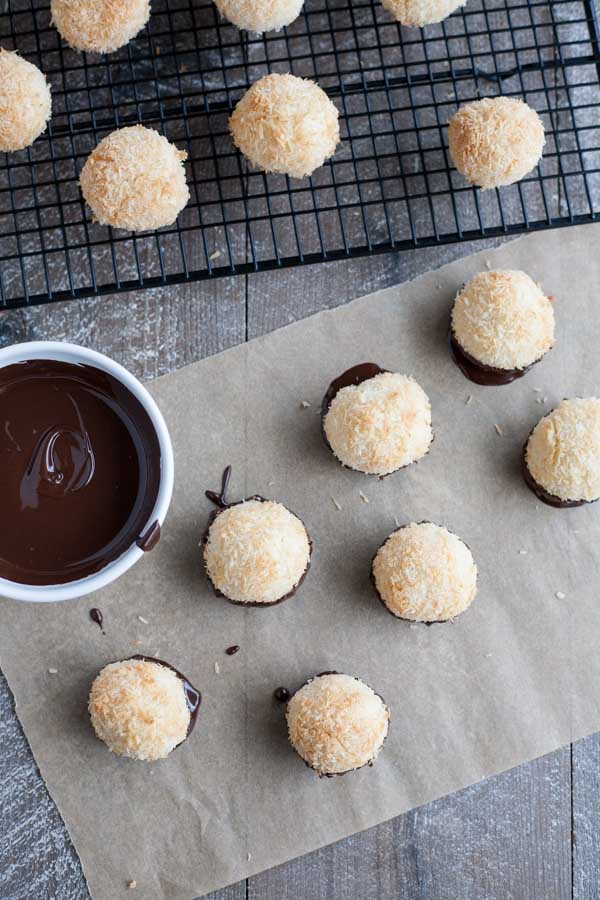 Easy Chocolate Dipped Coconut Macaroons | BourbonandHoney.com -- With double the coconut, these dark chocolate dipped coconut macaroons have a deliciously chewy inside and crispy outside for the perfect sweet treat!