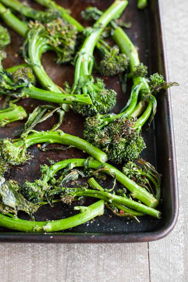 Easy Roasted Broccolini | BourbonandHoney.com -- This easy Roasted Broccolini is a super simple side dish recipe for weeknight dinners, brown bag lunches or snacking right from the sheet pan!