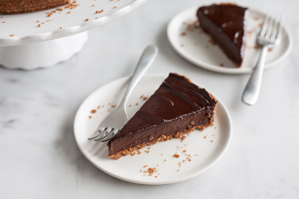 Bourbon and Honey Chocolate Tart | BourbonandHoney.com -- With a splash of bourbon, a drizzle of honey and a pretzel-graham cracker crust, this indulge chocolate tart is the perfect recipe for any chocolate lover!