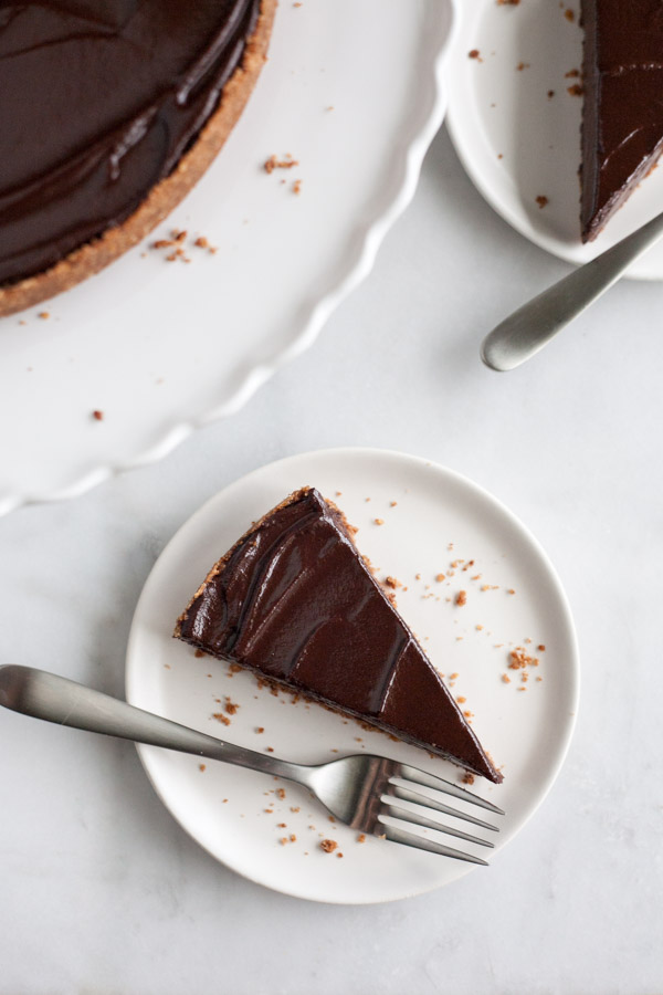 Bourbon and Honey Chocolate Tart | BourbonandHoney.com -- With a splash of bourbon, a drizzle of honey and a pretzel-graham cracker crust, this indulge chocolate tart is the perfect recipe for any chocolate lover!