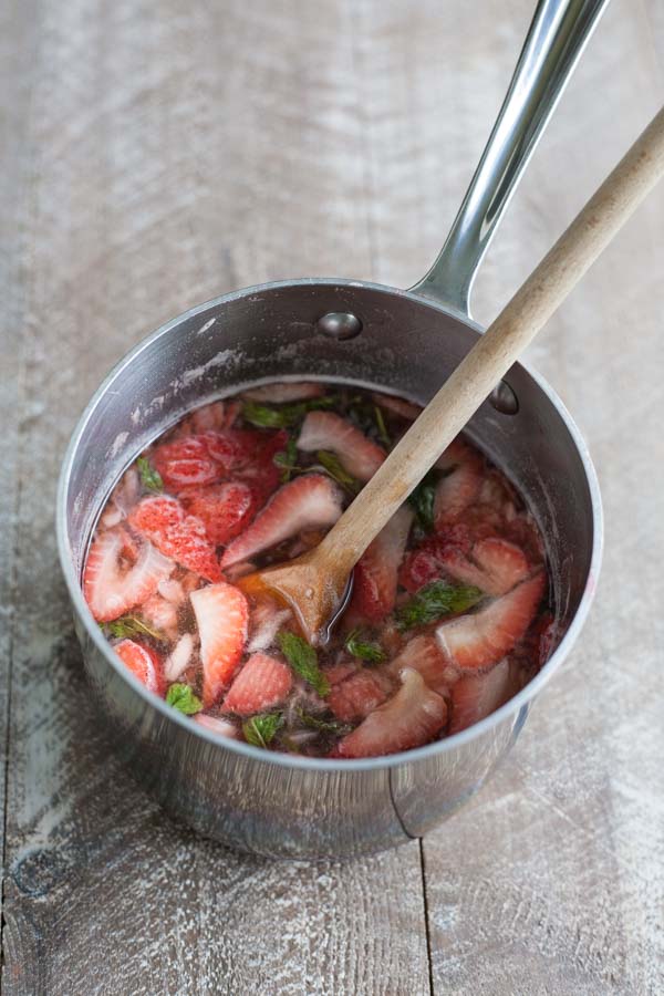 Bourbon and Honey Strawberry Mint Julep Popsicles | BourbonandHoney.com Square -- Frozen, boozy and super summery, these Bourbon and Honey spiked Strawberry Mint Julep Popsicles are going to be a keeper!