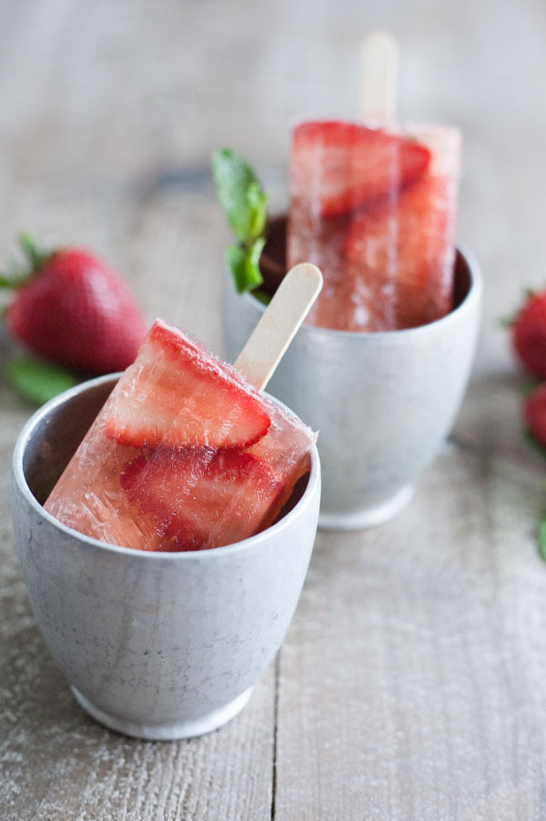 Bourbon and Honey Strawberry Mint Julep Popsicles | BourbonandHoney.com Square -- Frozen, boozy and super summery, these Bourbon and Honey spiked Strawberry Mint Julep Popsicles are going to be a keeper!