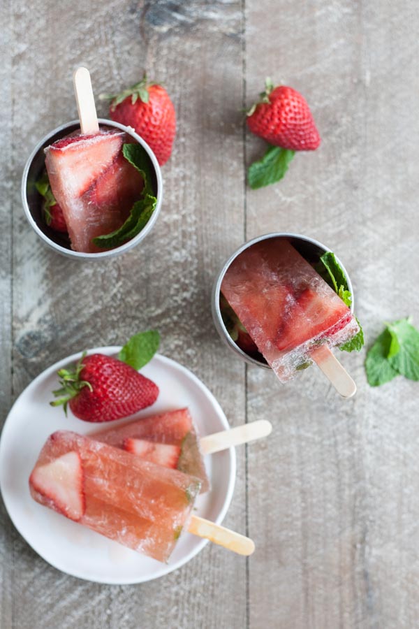 Bourbon and Honey Strawberry Mint Julep Popsicles | BourbonandHoney.com Square -- Frozen, boozy and super summery, these Bourbon and Honey spiked Strawberry Mint Julep Popsicles are going to be a keeper!