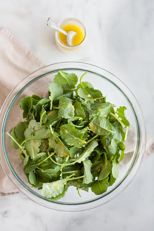 Baby Kale Salad with Crispy Parmesan Chickpeas | BourbonandHoney.com -- Simple, flavorful and impossibly easy, this Baby Kale Salad with Crispy Parmesan Chickpeas recipe is my go-to for both weeknight meals and dinner parties.