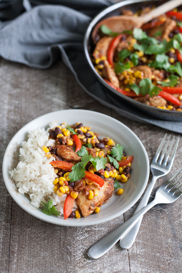 Easy Skillet Chicken with Black Beans and Corn | BourbonandHoney.com -- Spicy, delicious and on the table in 20 minutes, this Easy Skillet Chicken recipe is a serious weeknight winner and a quick family favorite!