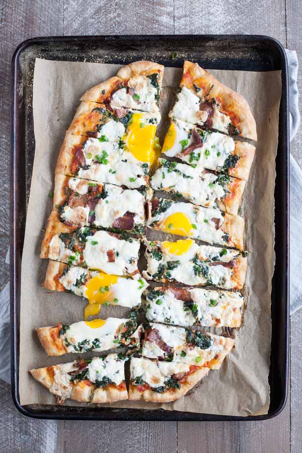 Bacon and Egg Burrata Breakfast Pizza | BourbonandHoney.com -- Start your morning right with this Bacon and Egg Burrata Breakfast Pizza recipe. It's cheesy, bacon-y and top with perfectly cooked eggs.