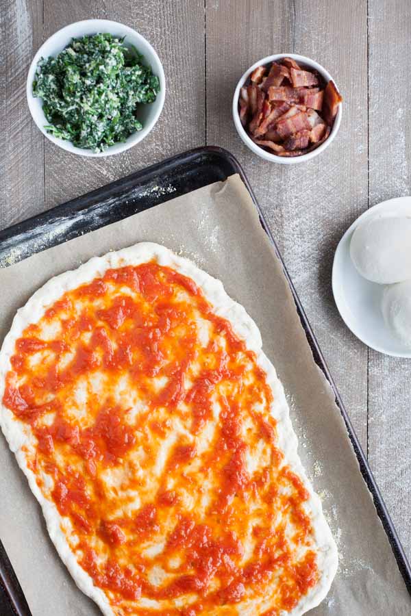 Bacon and Egg Burrata Breakfast Pizza | BourbonandHoney.com -- Start your morning right with this Bacon and Egg Burrata Breakfast Pizza recipe. It's cheesy, bacon-y and top with perfectly cooked eggs.