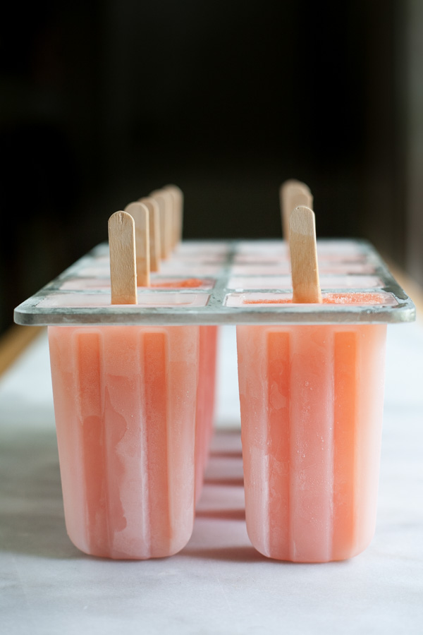 Boozy Aperol Spritz Popsicles | BourbonandHoney.com -- These slightly boozy Aperol Spritz Popsicles are the perfect recipe to cool down during the heat of summer, especially when served with a splash of Prosecco!