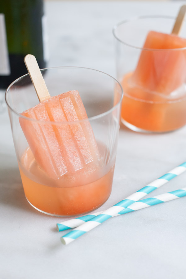 Boozy Aperol Spritz Popsicles | BourbonandHoney.com -- These slightly boozy Aperol Spritz Popsicles are the perfect recipe to cool down during the heat of summer, especially when served with a splash of Prosecco!