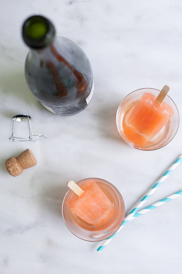 Boozy Aperol Spritz Popsicles | BourbonandHoney.com -- These slightly boozy Aperol Spritz Popsicles are the perfect recipe to cool down during the heat of summer, especially when served with a splash of Prosecco!