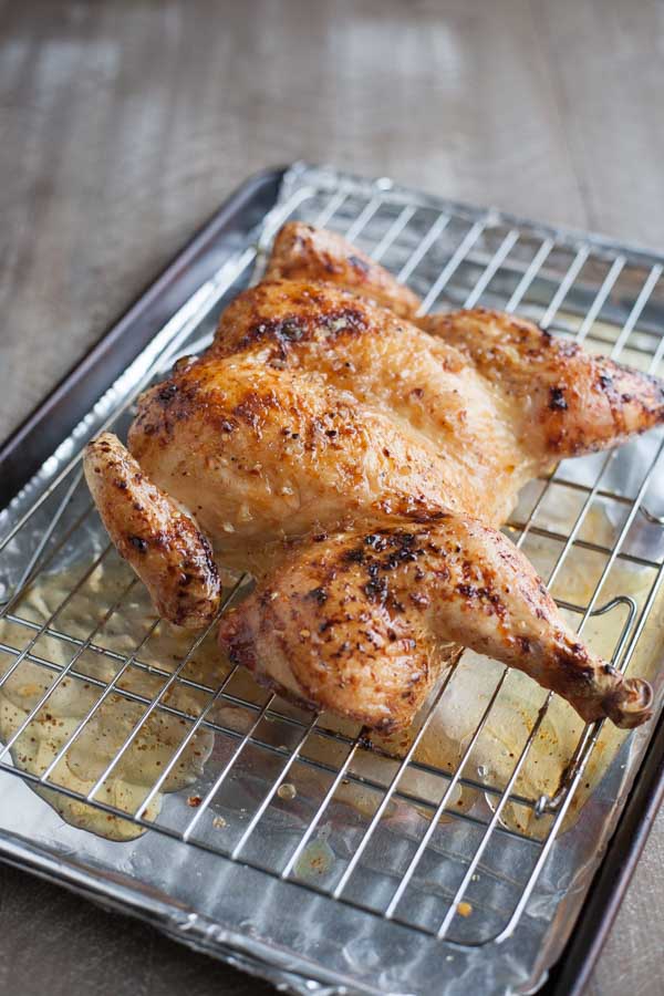 Bourbon and Honey Roasted Spatchcock Chicken | BourbonandHoney.com -- Sweet, subtly boozy and super easy, this Bourbon and Honey Roasted Spatchcock Chicken is the perfect roast chicken recipe for a crowd!