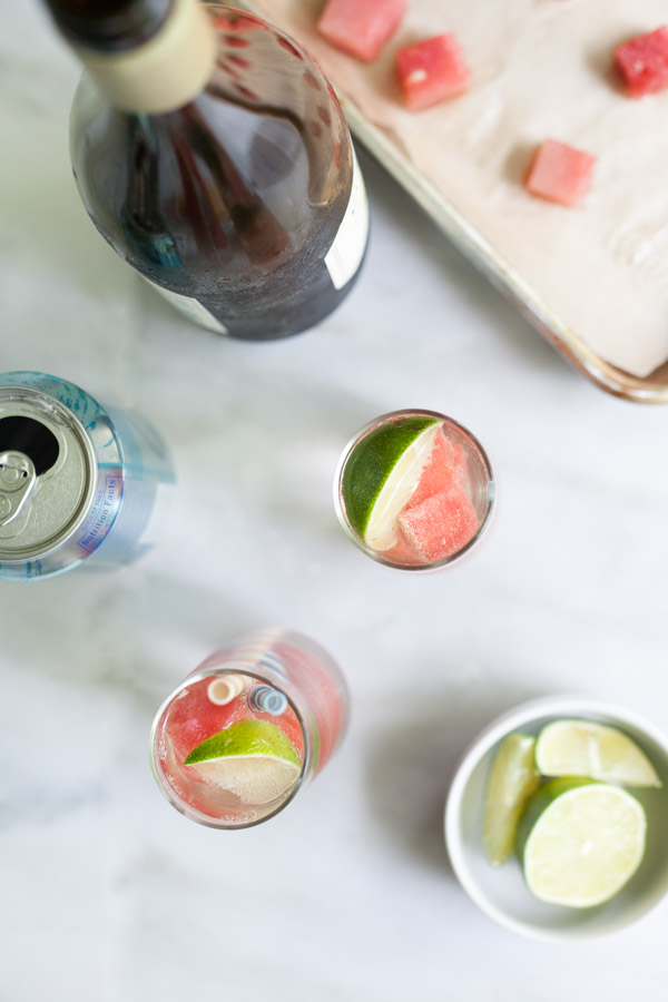 Fresh Watermelon White Wine Spritzer | BourbonandHoney.com -- This simple, refreshing and low alcohol white wine spritzer is chilled with frozen watermelon for the perfect warm weather cocktail.