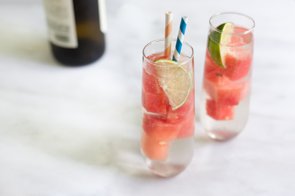 Fresh Watermelon White Wine Spritzer | BourbonandHoney.com -- This simple, refreshing and low alcohol white wine spritzer is chilled with frozen watermelon for the perfect warm weather cocktail.