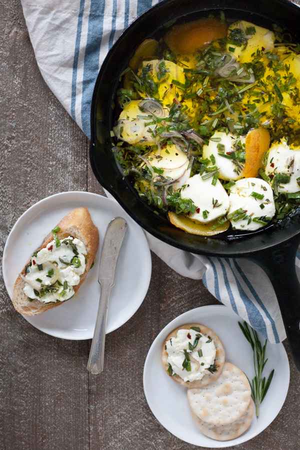 Baked Goat Cheese with Garlic and Herbs | BourbonandHoney.com -- This Baked Goat Cheese with Garlic and Herbs recipe is a quick and flavorful appetizer for a crowd. Besides being super easy, you can also make it ahead of time so you can really enjoy the party!