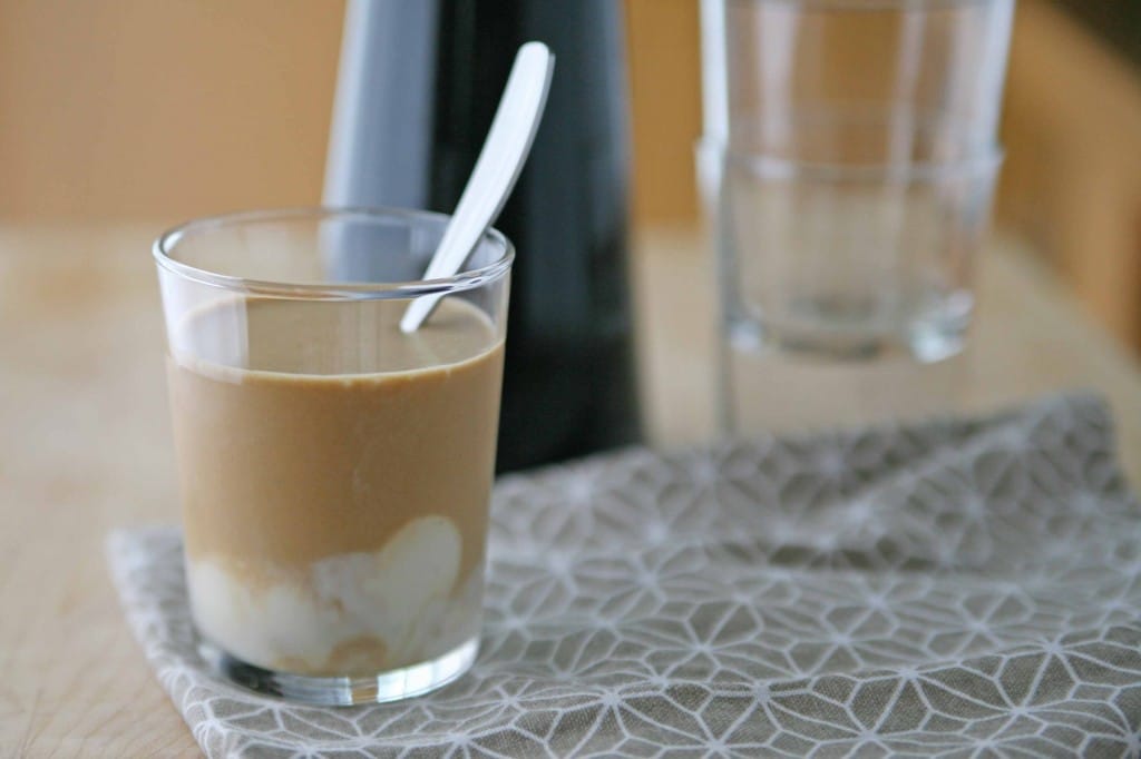 Cold Brewed Coffee with Vanilla Coconut Cream | BourbonandHoney.com -- Cold brewed coffee sweetened with ice cubes made from sweetened condensed milk, coconut milk and a vanilla bean. It's highly caffeinated, creamy and smooth.