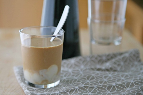 Cold Brewed Coffee with Vanilla Coconut Cream | BourbonandHoney.com -- Cold brewed coffee sweetened with ice cubes made from sweetened condensed milk, coconut milk and a vanilla bean. It's highly caffeinated, creamy and smooth.