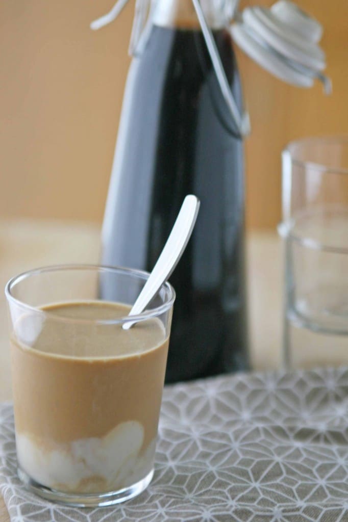 Cold Brewed Coffee with Vanilla Coconut Cream | BourbonandHoney.com -- Cold brewed coffee sweetened with ice cubes made from sweetened condensed milk, coconut milk and a vanilla bean. It's highly caffeinated, creamy and smooth.