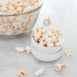 Spicy Popcorn | BourbonandHoney.com -- Spicy, salty and totally snackable. This Spicy Popcorn is a delicious twist on a classic snack.