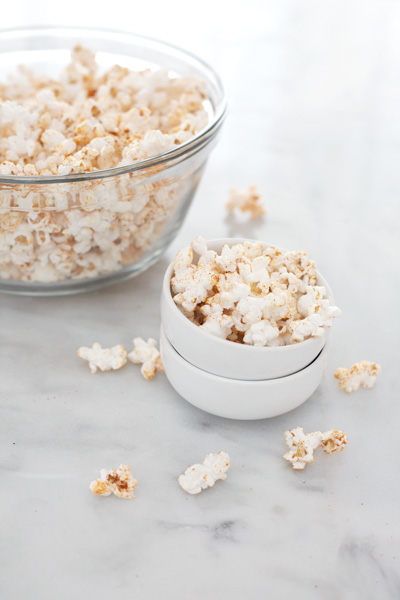 Spicy Popcorn | BourbonandHoney.com -- Spicy, salty and totally snackable. This Spicy Popcorn is a delicious twist on a classic snack.