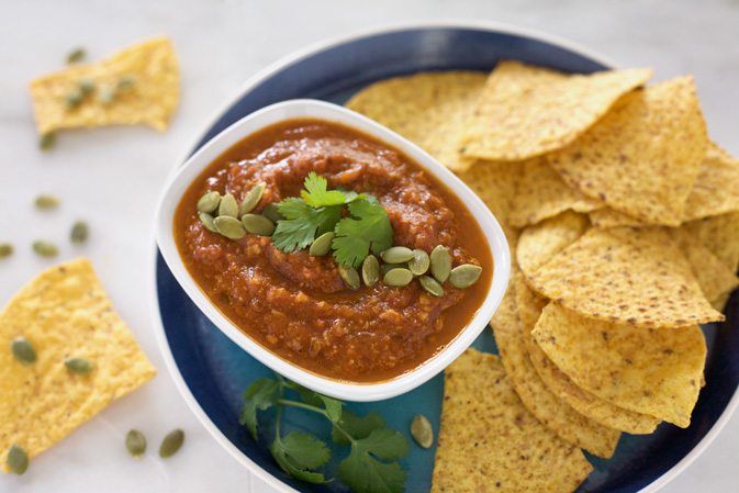 Roasted Tomato Salsa with Pepitas | BourbonandHoney.com -- This easy and mildly spicy homemade Roasted Tomato Salsa recipe is perfect for snacking, sharing or celebrating game day in style!