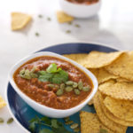 Roasted Tomato Salsa with Pepitas | BourbonandHoney.com -- A spicy homemade Roasted Tomato Salsa perfect for a snacking, sharing or a great game day appetizer.