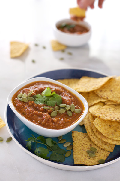 Roasted Tomato Salsa with Pepitas | BourbonandHoney.com -- This easy and mildly spicy homemade Roasted Tomato Salsa recipe is perfect for snacking, sharing or celebrating game day in style!