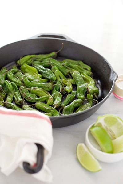 Shishito Peppers | BourbonAndHoney.com -- A quick recipe for blackened Shishito Peppers topped with fresh lime juice and salt for a perfect last minute snack or appetizer. 