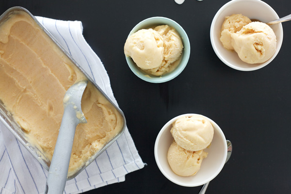 No Churn Coconut Peach Ice Cream | BourbonAndHoney.com -- This delicious Coconut Peach Ice Cream has all the fresh flavor of ripe summer peaches without an ice cream maker.