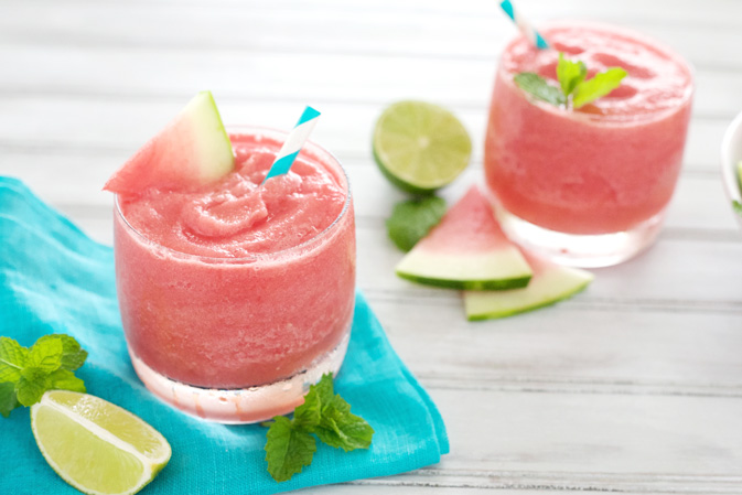 Watermelon Tequila Slush | BourbonandHoney.com -- This frosty, boozy and pretty pink Watermelon Tequila Slush cocktail is a tasty and refreshing way to keep you cool all summer long.