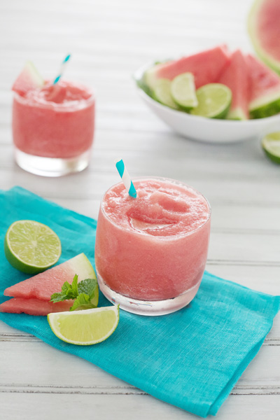 Watermelon Tequila Slush | BourbonandHoney.com -- This frosty, boozy and pretty pink Watermelon Tequila Slush cocktail is a tasty and refreshing way to keep you cool all summer long.