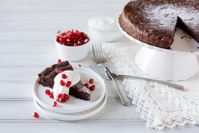 Easy Flourless Chocolate Cake -- This flourless chocolate cake is easy, indulgent and in the oven in under 15 minutes! Only 6 ingredients to boot! | BourbonandHoney.com