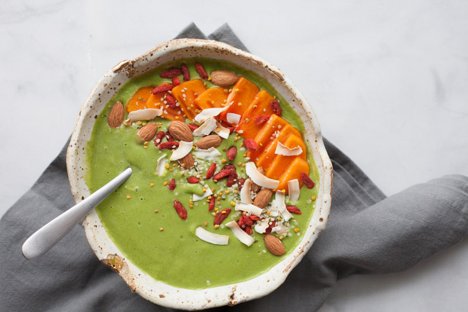 Green Smoothie Bowl | BourbonandHoney.com -- This kale and mango Green Smoothie Bowl is topped with fresh and tasty toppings for a healthy pick-me-up. 