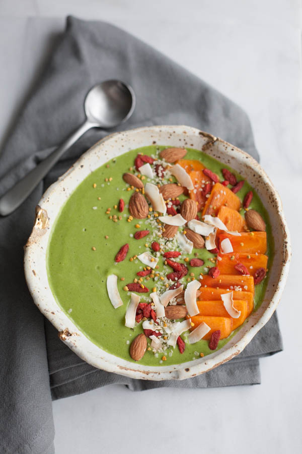 Green Smoothie Bowl | BourbonandHoney.com -- This kale and mango Green Smoothie Bowl is topped with fresh and tasty toppings for a healthy pick-me-up. 
