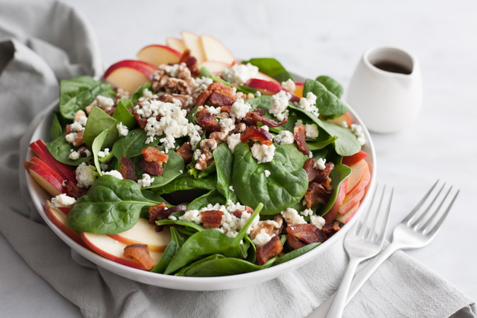 Apple, Blue Cheese and Bacon Chop Salad | BourbonandHoney.com -- This chopped bacon and blue cheese salad is packed with fresh apples, crumbled blue cheese, crispy bacon topped with a dijon vinaigrette.