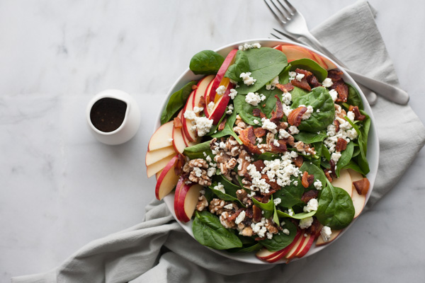 Apple, Blue Cheese and Bacon Chop Salad | BourbonandHoney.com -- This chopped bacon and blue cheese salad is packed with fresh apples, crumbled blue cheese, crispy bacon topped with a dijon vinaigrette.